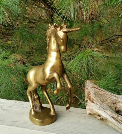 https://www.etsy.com/listing/474160504/solid-brass-unicorn-figurine-vintage?