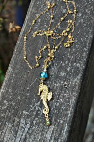 https://www.etsy.com/ca/listing/463348286/golden-seahorse-necklace-with-blue-glass?